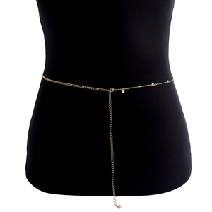 Elegant gold metal body chain with star charms displayed on a black mannequin waist