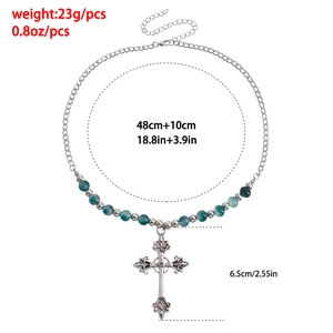 Detailed view of vintage multilayer cross necklace with blue beads and size measurements