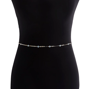 Minimalist gold waist chain featuring blue evil eye charms on a slender link chain
