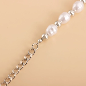 Detail of baroque pearls and silver metal beads necklace with an adjustable chain