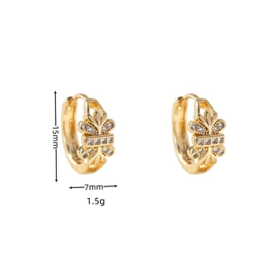 Detailed view of 15mm gold-plated leaf earrings with cubic zirconia and iris patterns