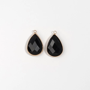 Pair of teardrop black faceted pendants with gold-plated metal edges for DIY jewelry making