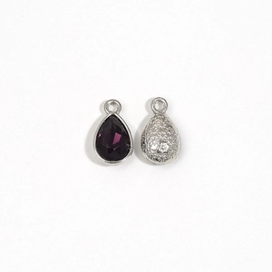 Silver pear-shaped crystal pendant with deep purple faceted stone and metal base