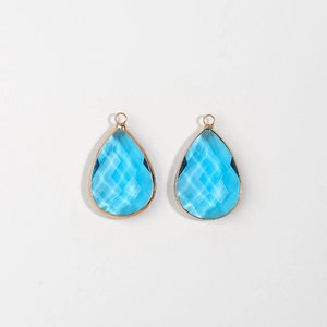 Pair of sky blue faceted teardrop pendants with gold plated frames for jewelry DIY