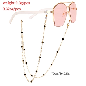 Lunettes de soleil roses hexagonales avec chaîne dorée de 77cm et perles noires