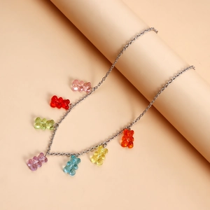 Detailed close-up of colorful resin gummy bear pendants on a silver metal chain necklace