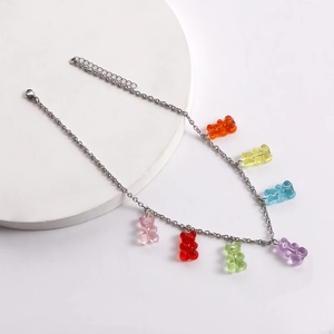 Detailed view of rainbow gummy bear charms on a silver chain necklace for women