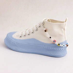 Platform high-top sneakers with pearls and colorful evil eye anklet charm decoration