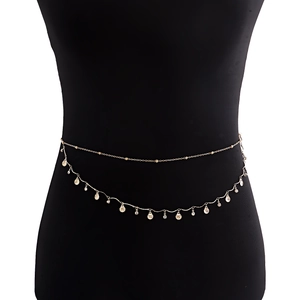 Minimalist gold-tone layered body chain featuring scallop shell charms and zircon accents