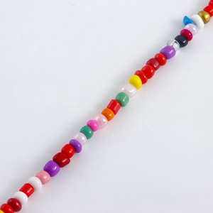 Detailed macro view of colorful handmade bohemian glass beads for multi-layer shoe chains