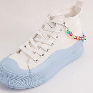 White high-top canvas sneakers with light blue platform sole and colorful star bead chain