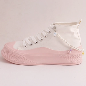 Pink and white platform high-top canvas sneakers with faux pearl and floral charms