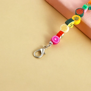 Detail of colorful polymer clay fruit beads shoe chain with silver lobster clasp closure
