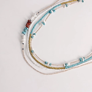 Detail view of multi-layer Bohemian body chain with turquoise and heart beads