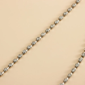 Macro view of multi-layered silver prong-set rhinestone chain with square crystals