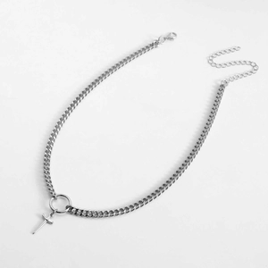 Close-up of silver cross sword pendant necklace with chunky chain and lobster clasp