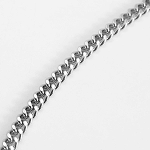 Detailed macro view of the silver cuban curb chain with polished finish and tight links