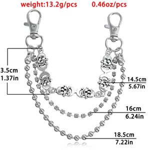 Three-layer silver bead and rhinestone chain with skull charms and lobster clasps