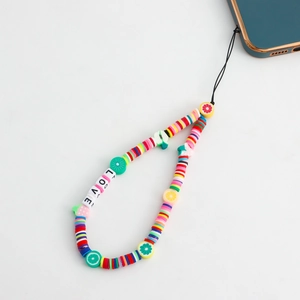 Detailed close-up of rainbow beaded phone strap with fruit charms and LOVE square letters