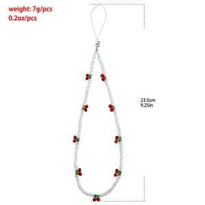 Detail of beaded phone strap with white seed beads and red cherry charms plus dimensions
