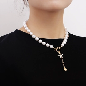 Elegant pearl necklace with rhinestone starfish pendant and gold shell beach accessory