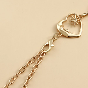 Golden waist chain featuring romantic sun and moon heart pendant for stylish women dresses