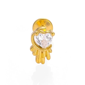 Macro shot of gold heart-shaped labret stud with crystal and flat back for piercings