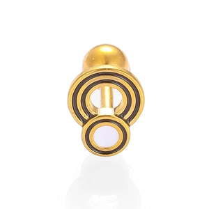 Macro detail of golden 316L stainless steel helix stud with geometric circle patterns