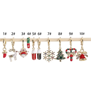Festive gold Christmas earrings collection featuring reindeer, Santa, and zircon charms