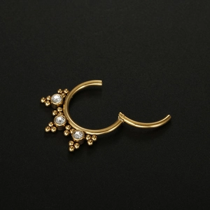 16G Gold plated stainless steel septum clicker ring featuring three clear cubic zirconias