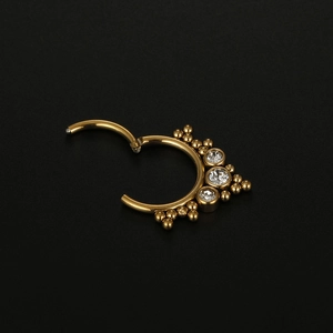 316L Edelstahl Septum Nasenring in Gold mit drei weißen Zirkoniasteinen besetzt