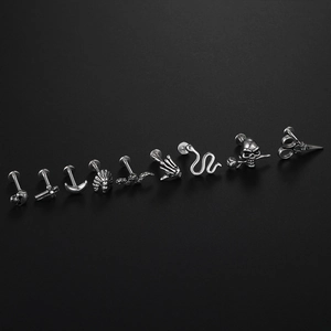 Set of 9 vintage silver stainless steel studs featuring gothic skull moon and snake designs