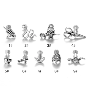 Set of nine 16G stainless steel stud earrings with punk snake and skull designs