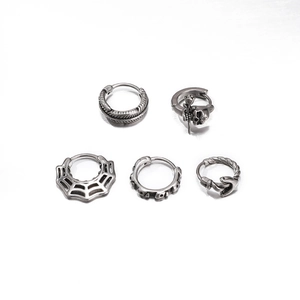 Gothic punk earring set with skull, feather, and spider web charms in aged silver finish