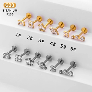 Collection of G23 titanium labret studs with cubic zirconia in gold and silver finishes
