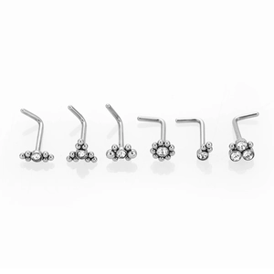 Detail view of 6-piece silver L-shaped nose stud set with white zircon crystal inlays