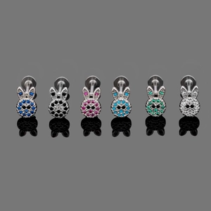 Detail view of 316L stainless steel bunny labrets with colorful inlaid zircon stones