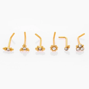 Detailed set of 6 gold L-shaped nose studs with zircon and bead designs on white background