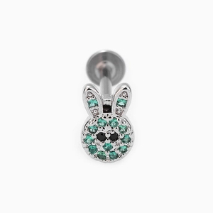 Macro view of 316L stainless steel bunny ear stud with green and black zircons