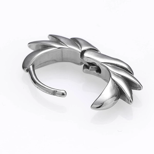 Polished silver wing feather hoop earrings in punk style shown on white mirror background