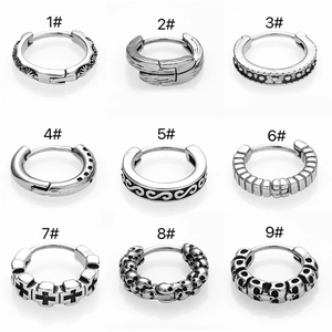 Collection of nine vintage gothic stainless steel earrings with skull and cross designs