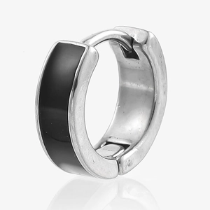 Macro detail of stainless steel hoop earrings with black enamel inlay and polished finish