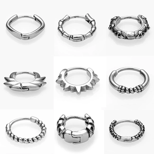 Nine gothic punk titanium steel huggie earrings featuring various textured silver designs