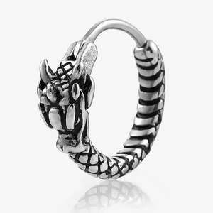 Detailed view of punk-style dragon head huggie earring in vintage silver finish
