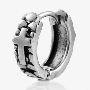 Macro detail of Gothic cross embossed hoop earring with retro vintage black finish