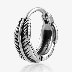 Detailed view of gothic feather engraved stainless steel hoop earring with black oxidation