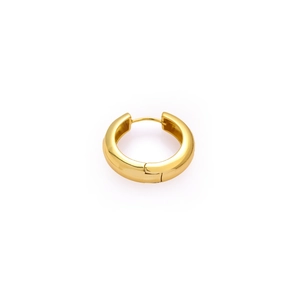 Detail of chunky gold hoop earring with a polished finish and secure hinge closure