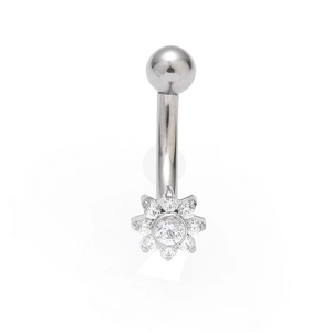 Macro shot of stainless steel eyebrow ring with sparkling zircon flower and curved barbell