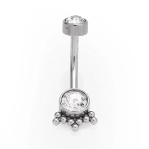 Detailed macro view of 316L stainless steel belly ring with clear zircon flower cluster