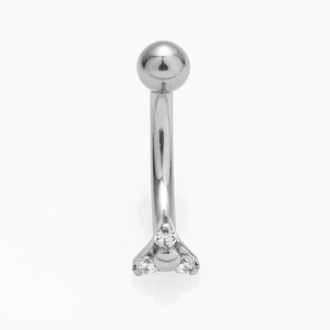 Detail of curved eyebrow barbell with three clear zircons in flower pattern